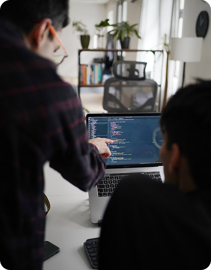 Infinite Option developer building a client website at the office